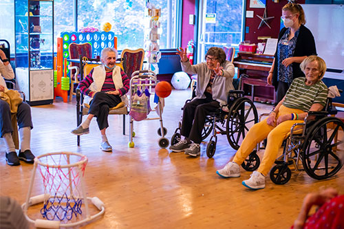 Residents playing indoor basketball